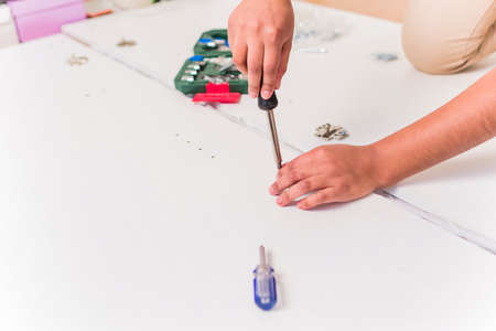 independent and success Bolivian Latin woman assembly and fix repair in moving houseの写真素材