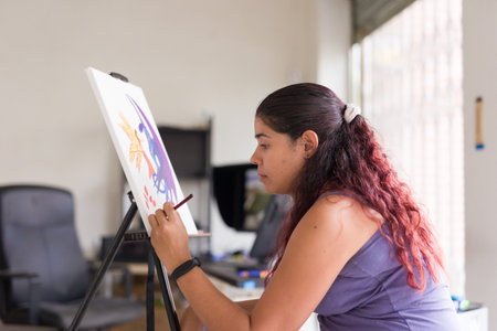 painting concentration and inspiration for mental wellbeing. south american venezuelan womanの写真素材