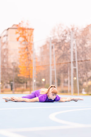 Morning sport warm up stretching balance. Hispanic mid female argentinian acrobat in sportwear.