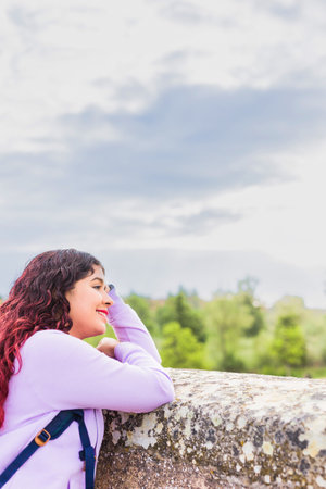 European travel in old Salamanca town. Happy Hispanic mid woman outdoors in Spain. Lifestyleの写真素材