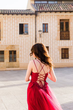 Education college graduate, happy student. Hispanic woman in Salamanca, Spain, outdoors smilingの写真素材