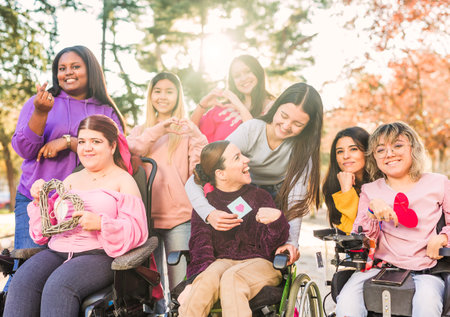 InspireInclusion international womens day. Multiethnic group do heart love hand gesture. Disabilityの写真素材