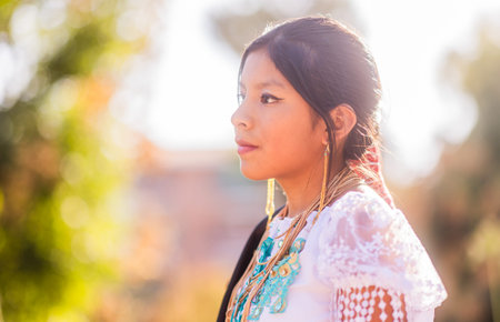 Young girl wearing traditional andean dress celebrating hispanic heritage. Dia de la hispanidad