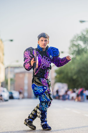 Hispanic dancer performing with tambourine during national hispanic heritage month parade