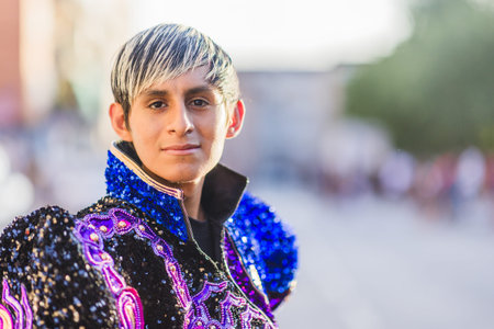 Young dancer wearing colorful costume celebrating hispanic day parade. Dia de la hispanidad