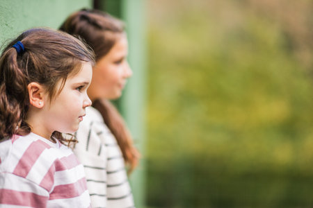 Sisters learning about animal care at a sanctuary in asturias, spainの写真素材
