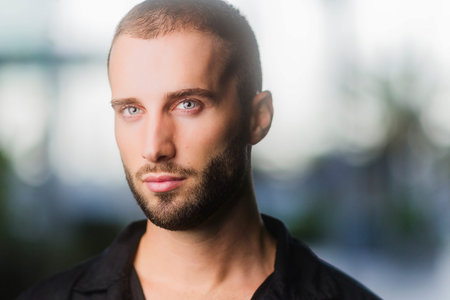 Hispanic Young man portrait looking directly at camera