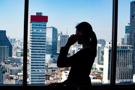 Women talking business mobile phoneの写真素材