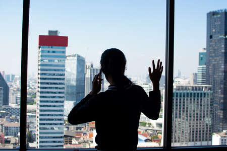 Women talking business mobile phoneの写真素材