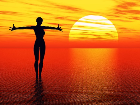 Good morning sunshine. Praying woman reaching for the rising sunの写真素材