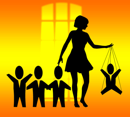 woman treating men like marionettes, concept of humiliation and dominationの写真素材