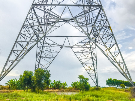 High power pylons and natural green with clear skies.の写真素材