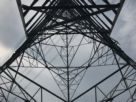 High power pylons and natural green with clear skies.の写真素材
