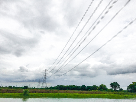 High power pylons and natural green with clear skies.の写真素材