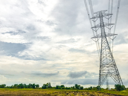 High power pylons and natural green with clear skies.の写真素材