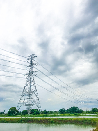 High power pylons and natural green with clear skies.の写真素材