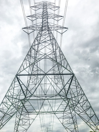 High power pylons and natural green with clear skies.の写真素材
