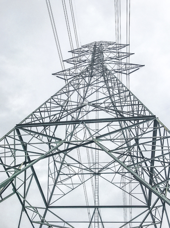 High power pylons and natural green with clear skies.の写真素材