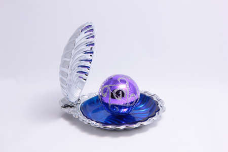 Toy ball in the bottom of a decorative shell の写真素材