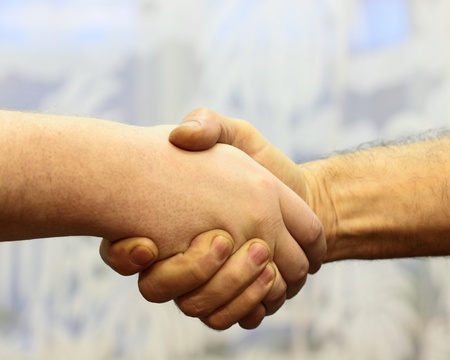 Friendly handshake business partnersの写真素材