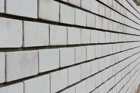 Have just laid out the wall of white brick in cement mortar in perspective の写真素材