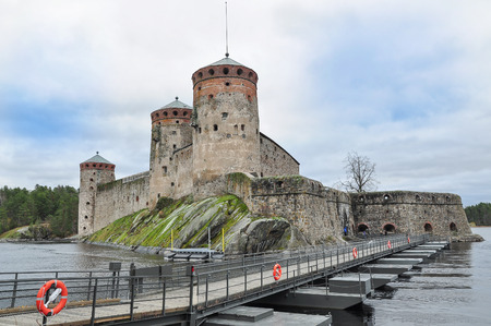 Ancient fortress building and wooden bridge crossing located near Helsinki  Finland の写真素材