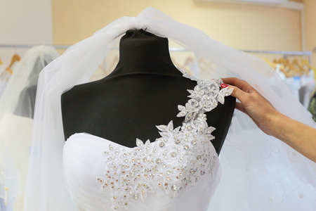 Looking at the beautiful elegant dress for the wedding ceremony.の写真素材