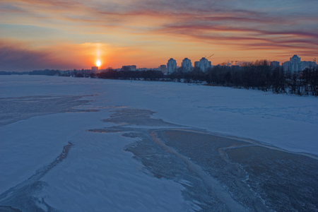 Winter sunset over the city.の写真素材
