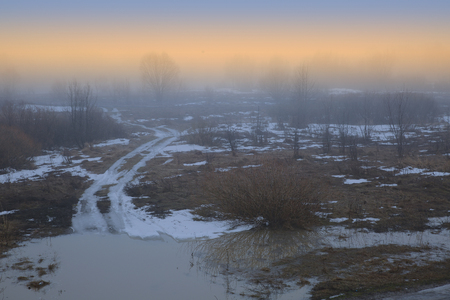 A warm fog of a spring evening in the suburbs.の写真素材
