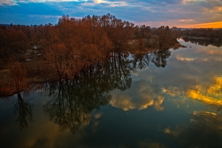 Autumn sunset over the river.の写真素材