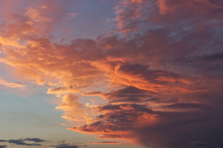Beautiful blue sky with clouds of various shapes and colors.の写真素材