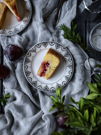 Plum cake on a plate on a wooden background. selective focus.の写真素材