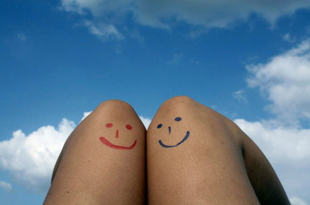 Red and blue emoticons under the skyの写真素材