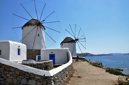 White cycladic windwill in a sunny dayの写真素材