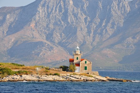 Sucuraj lighthouse and mountains in fog in the backgroundの写真素材
