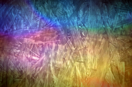 Multi colored particle chipboard board desk backgroundの写真素材