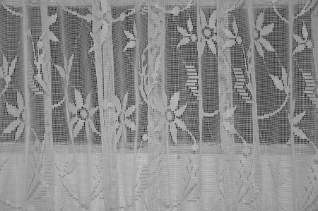 Frilly transparent curtains detail vintage white textile backgroundの写真素材