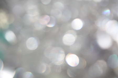 Silver glitter light blurred blur bokeh style party backgroundの写真素材