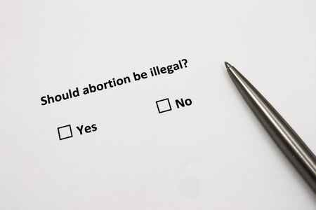 Should abortion be illegal? Abortion controversal topic concept.の写真素材