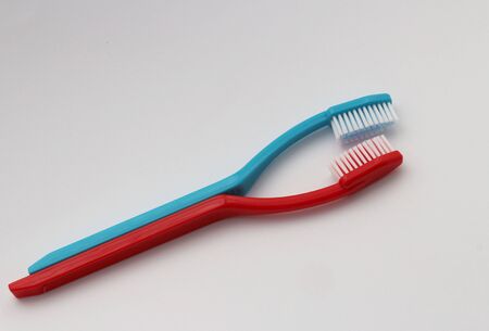 Two kissing toothbrushes, are like couple in love.の写真素材