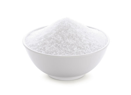 monosodium glutamate in wood bowl on white background