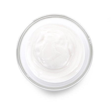 bowl of sour cream yogurt isolated on white backgroundの写真素材