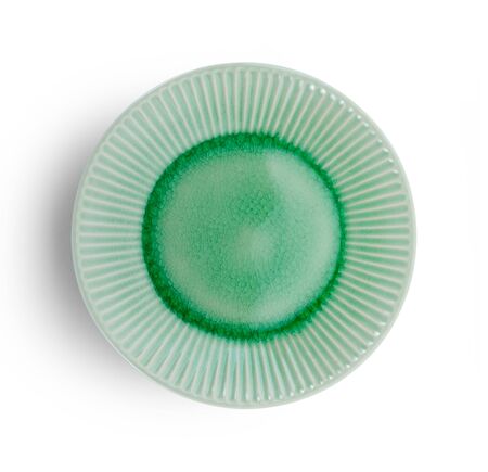 vintage ceramic plate on white backgroundの写真素材