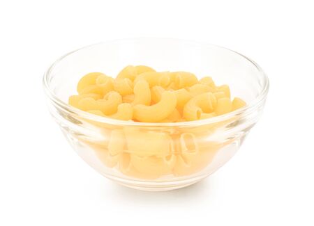 Macaroni in a glass cup on white backgroundの写真素材