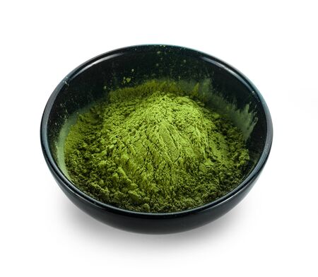 powdered matcha green tea in bowl, isolated on white backgroundの写真素材