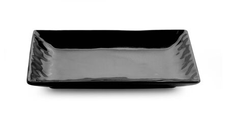 empty black plate isolated on white backgroundの写真素材