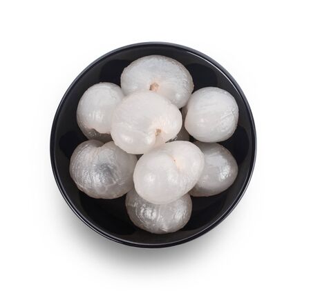 Longan in bowl isolated on white backgroundの写真素材