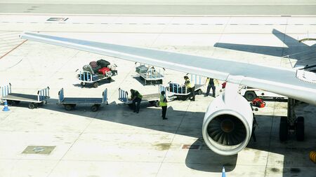Load and unload of a plane in the airportのeditorial素材