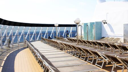Deck chairs on the deck of a cruiseの写真素材