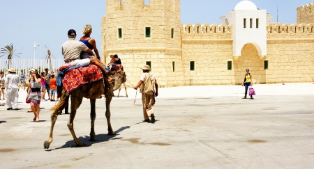 Tourists in a camel in the port of The Goulette, Tunisのeditorial素材
